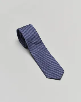Blue and indigo micro-textured pure silk tie.